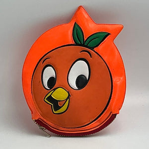 Orange character with a face on a gray background